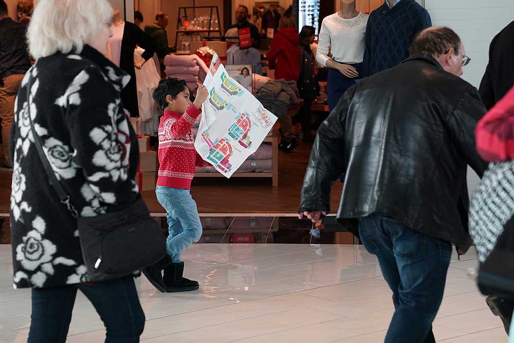 A boy reads a map of the King of Prussia mall, one of the largest retail malls in the US, in Pennsylvania November 29, 2019. The US services sector slowed in November. u00e2u20acu201d Reuters pic