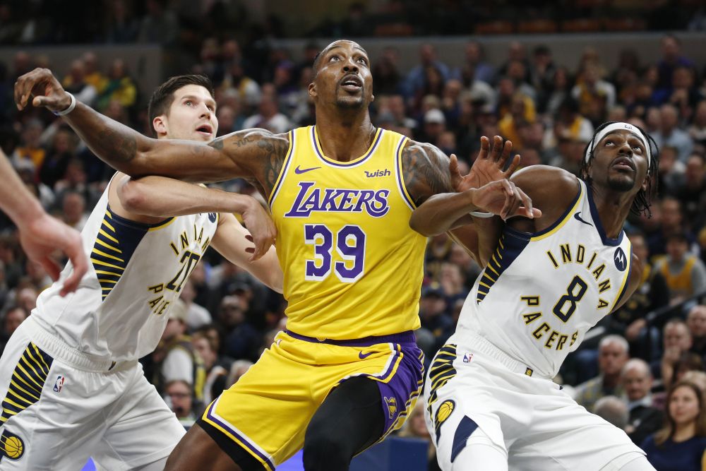 Los Angeles Lakers center Dwight Howard (39) battles for rebounding position against Indiana Pacers guard Justin Holiday (8) and forward Doug McDermott (20) during the first quarter at Bankers Life Fieldhouse. u00e2u20acu201d Reuters pic