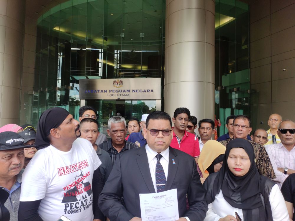 Umno supreme council member Datuk Lokman Noor Adam speaks to reporters at the entrance of the Attorney Generalu00e2u20acu2122s Chambers in Kuala Lumpur December 31, 2019. u00e2u20acu2022 Picture by Kenneth Tee