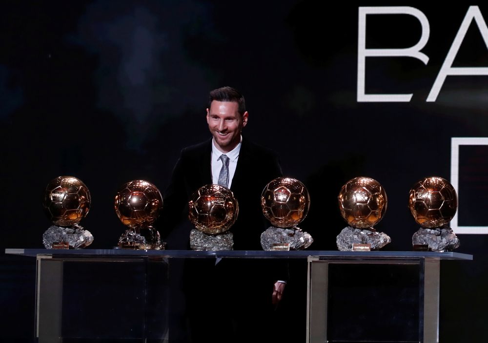 Barcelona's Lionel Messi poses with his six Ballon d'Or trophies. u00e2u20acu201d Reuters pic