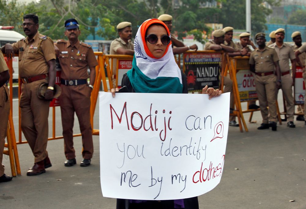 A demonstrator displays a placard as she attends a protest against a new citizenship law, in Chennai, India, December 20, 2019. u00e2u20acu201d Reuters pic