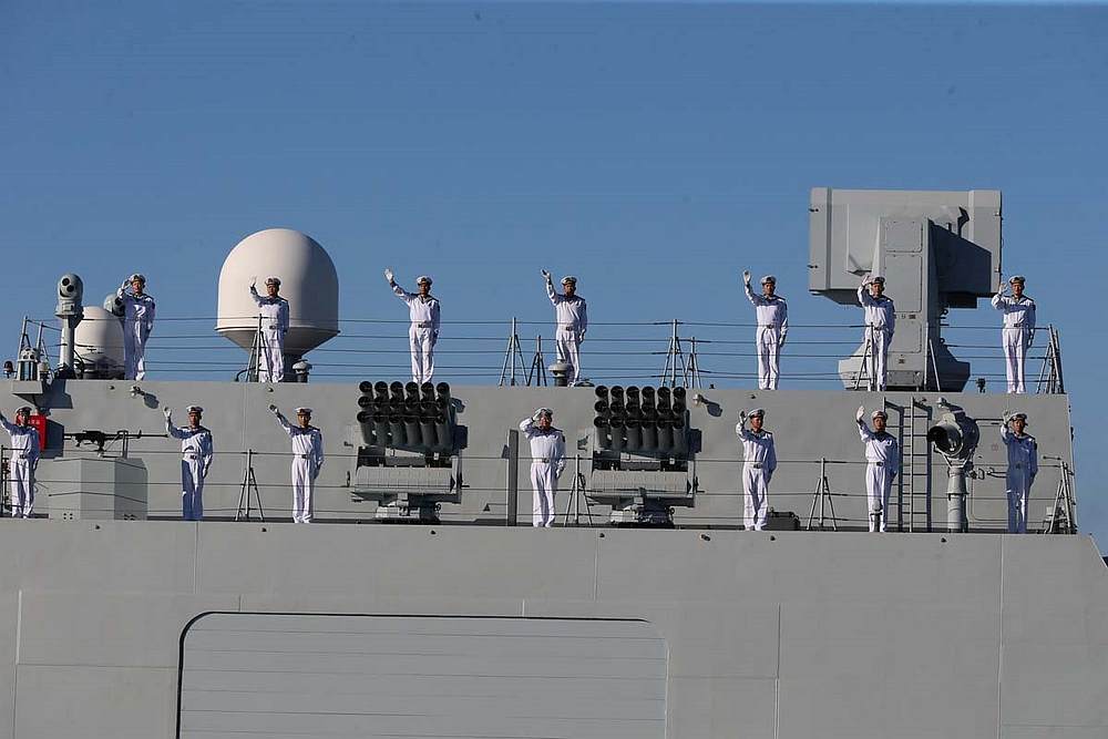 Chinese Navy members wave while approaching Iran's southeastern port city of Chahbahar, during joint naval drills held by Iran, China and Russia in the Gulf of Oman, Iran, December 27, 2019. u00e2u20acu201d Wana pic via Reuters 
