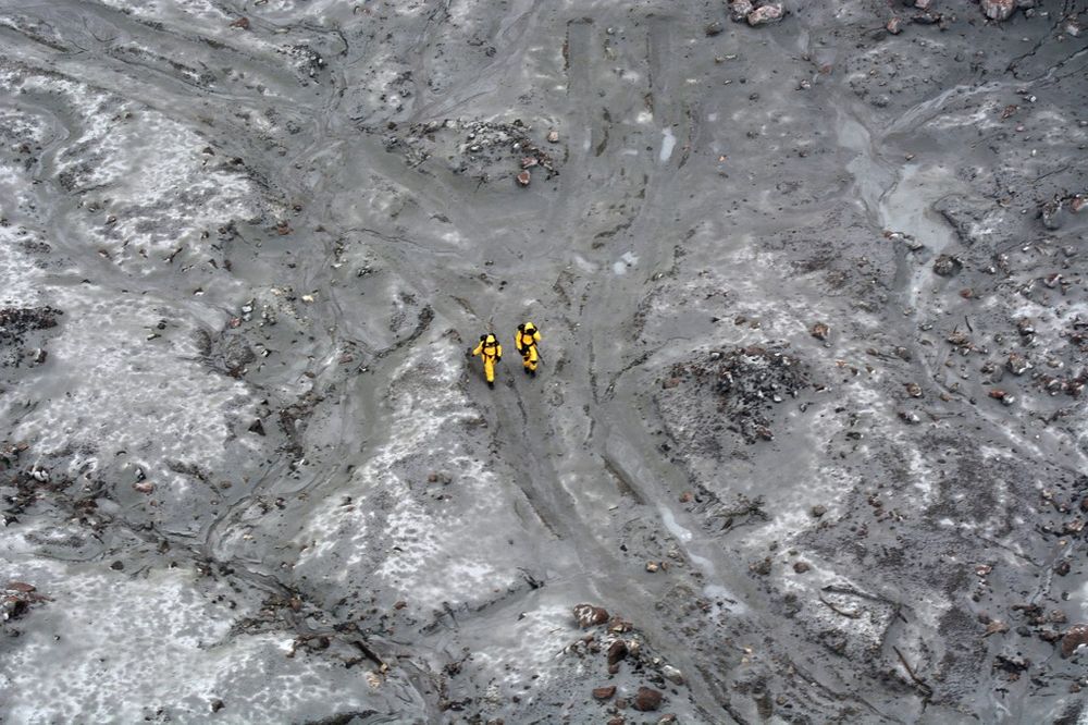 This handout aerial photo taken and released on December 13, 2019 by the New Zealand Defence Force shows elite soldiers taking part in a mission to retrieve bodies from White Island after the December 9 volcanic eruption. u00e2u20acu201d AFP pic