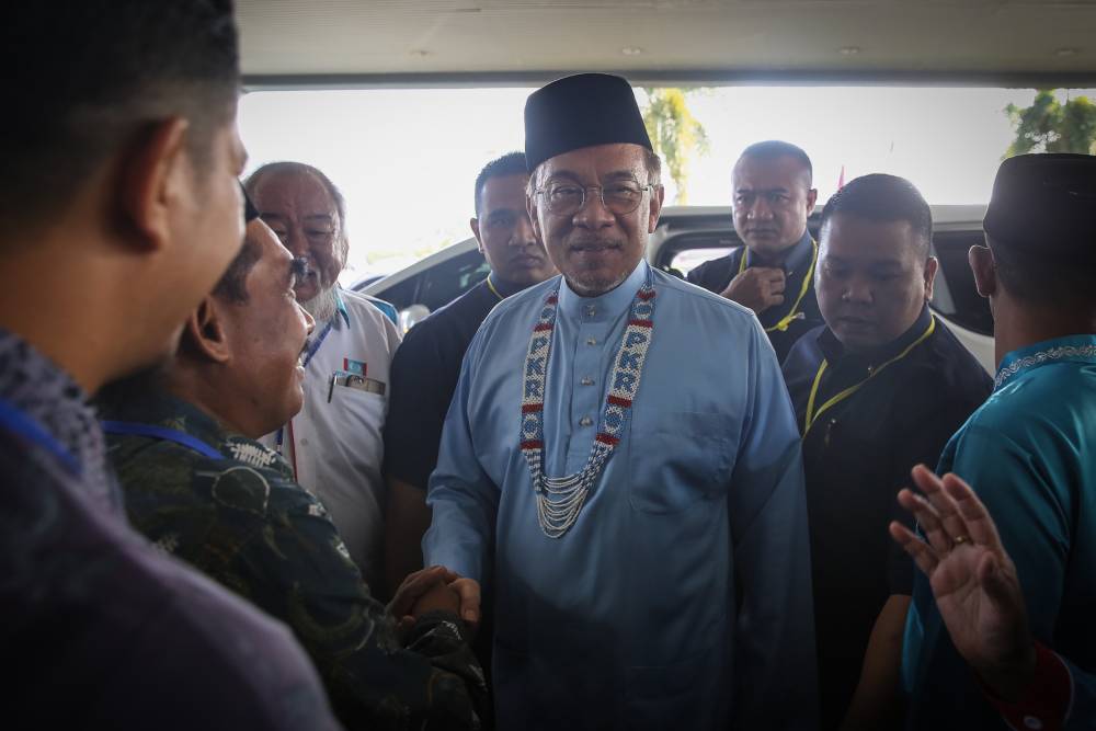 PKR president Datuk Seri Anwar Ibrahim (centre) arrives at the 2019 PKR National Congress in Melaka December 7, 2019. u00e2u20acu2022 Picture by Yusof Mat Isa