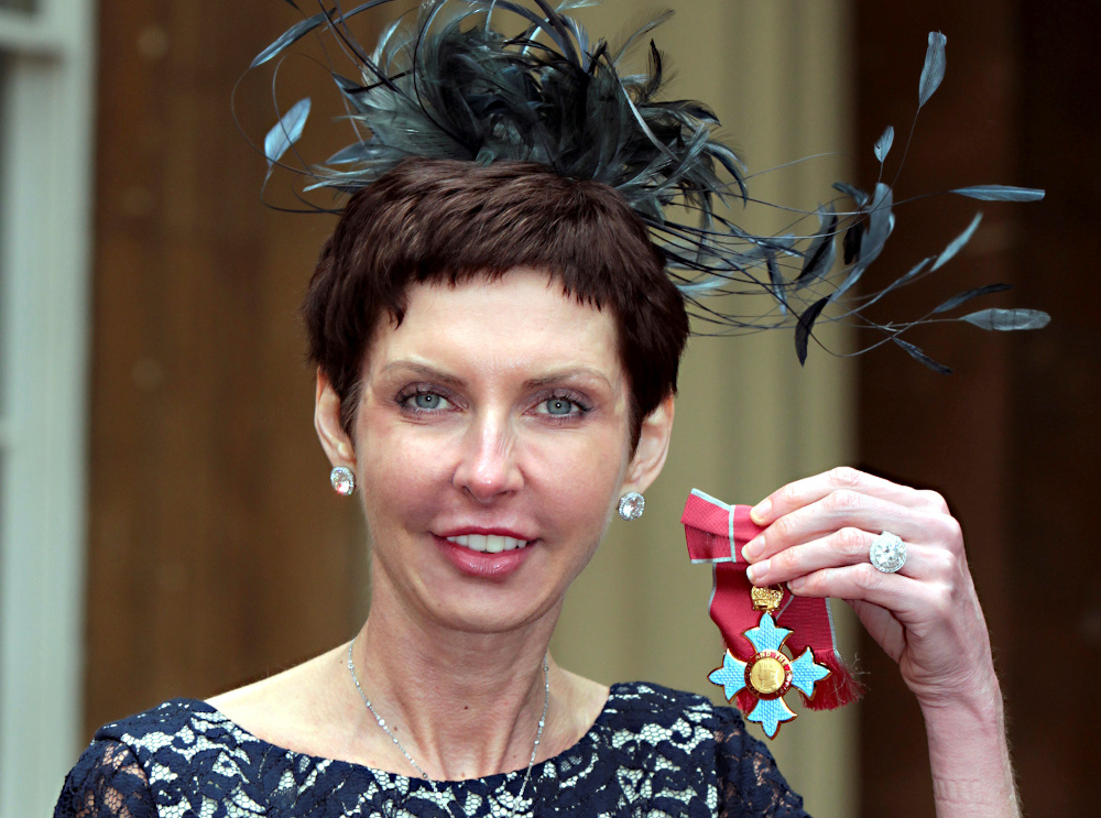 bet365 Chief Executive Denise Coates poses with her Commander of the British Empire (CBE) medal after being knighted by Britainu00e2u20acu2122s Prince Charles at Buckingham Palace in London May 15, 2012. u00e2u20acu201d Reuters pic
