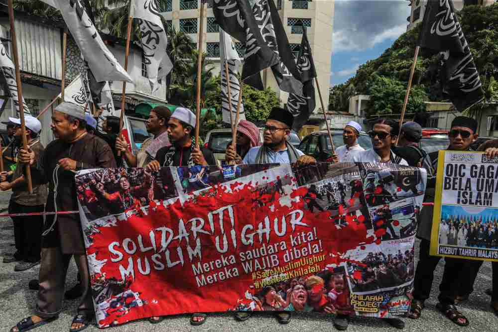Protesters carry placards and posters in front of the Chinese embassy in Kuala Lumpur December 27, 2019. ― Picture by Firdaus Latif