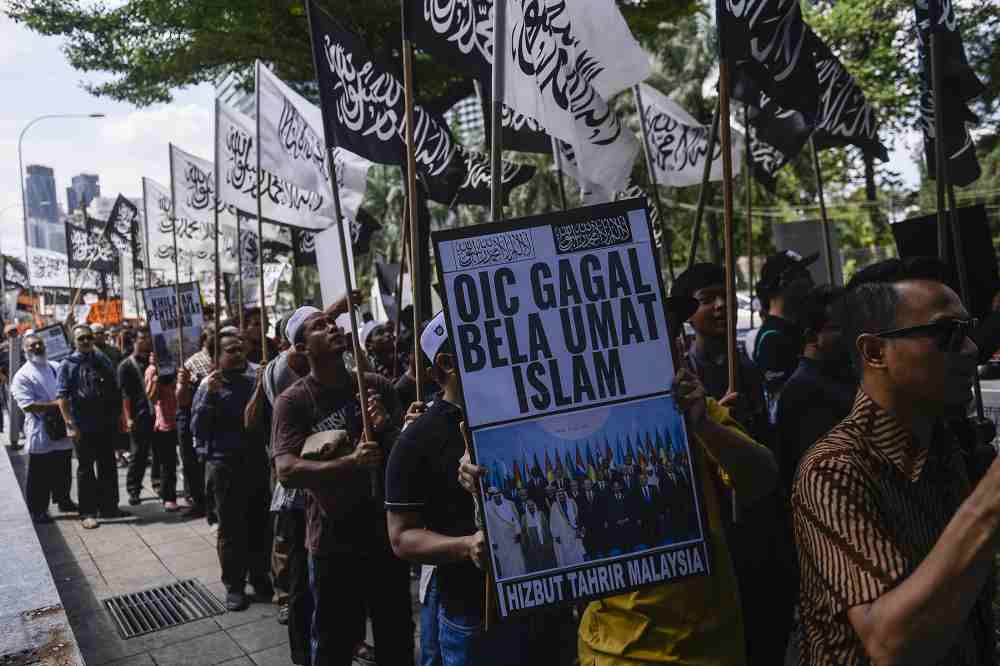 Hizbut Tahrir protesters carry placards during a protest held in solidarity with the Uighur community in China, December 27, 2019. u00e2u20acu2022 Picture by Miera Zulyana