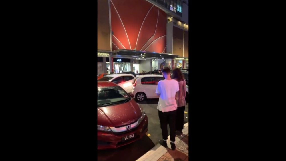 Angry driver smashes into a double-parked car outside Bangsar Village. ― Screengrab via Twitter/Chrischew_