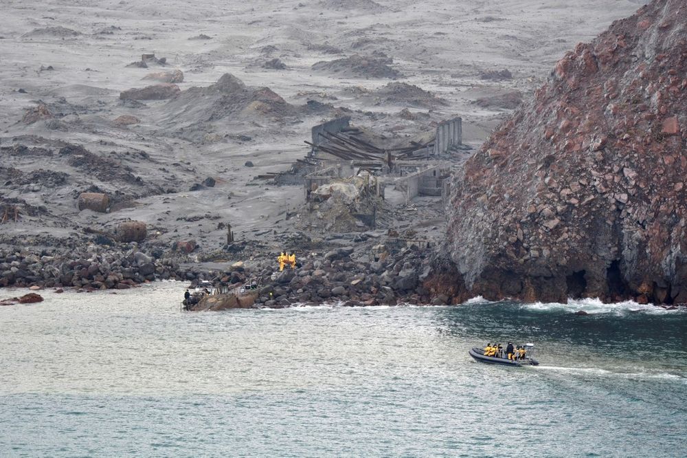This handout photo taken and released on December 13, 2019 by the New Zealand Defence Force shows elite soldiers taking part in a mission to retrieve bodies from White Island. u00e2u20acu201d AFP pic