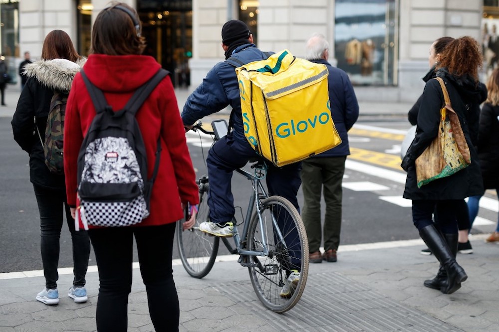 A worker of Glovo, rides his bike during a delivery, in Barcelona December 3, 2019. u00e2u20acu201d AFP pic
