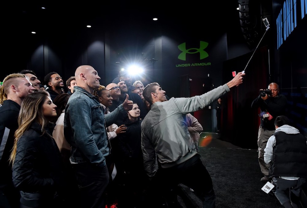 Former record-winning US Olympian swimmer Michael Phelps takes a selfie on stage at the 2020 Under Armour Human Performance Summit in Baltimore, Maryland January 14, 2020. u00e2u20acu201d AFP pic