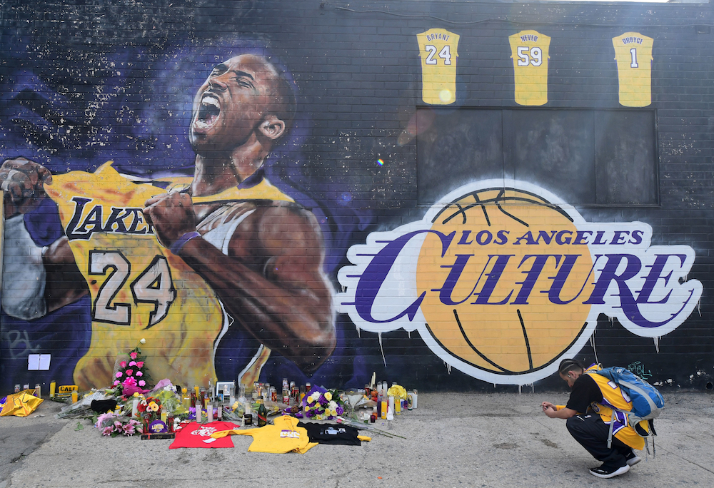 People gather in front of a Kobe Bryant mural in downtown Los Angeles January 28, 2020. u00e2u20acu201d AFP pic