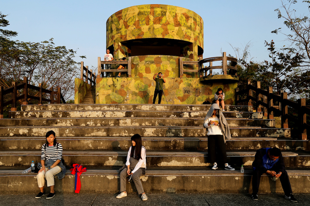 People wait to watch the sunset at a former military observation post in Leidishan Natural Park, Kaohsiung January 1, 2020. u00e2u20acu201d Reuters pic