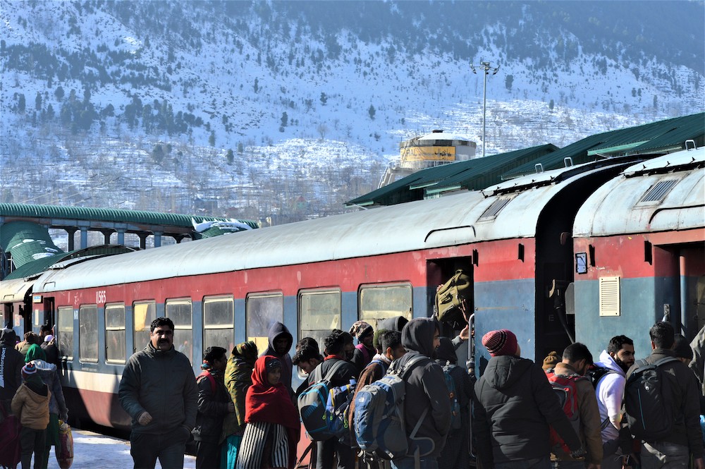 Commuters line up at a train station in Banihal, India December 23, 2019. u00e2u20acu201d Thomson Reuters Foundation/Athar Parvaiz pic