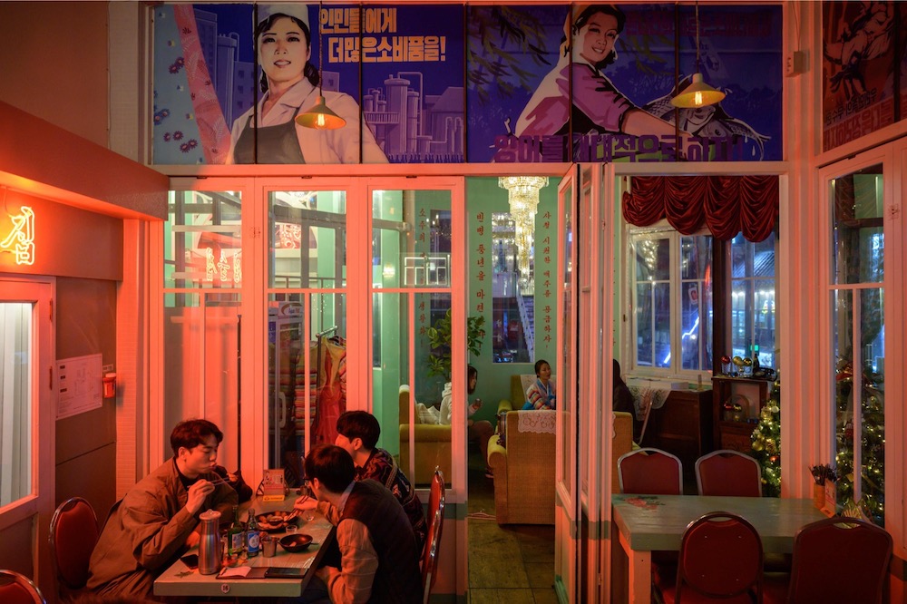 A photo taken on January 10, 2020 shows diners at the North Korean-themed Pyeongyang Bar in the Hongdae district of Seoul. — AFP pic