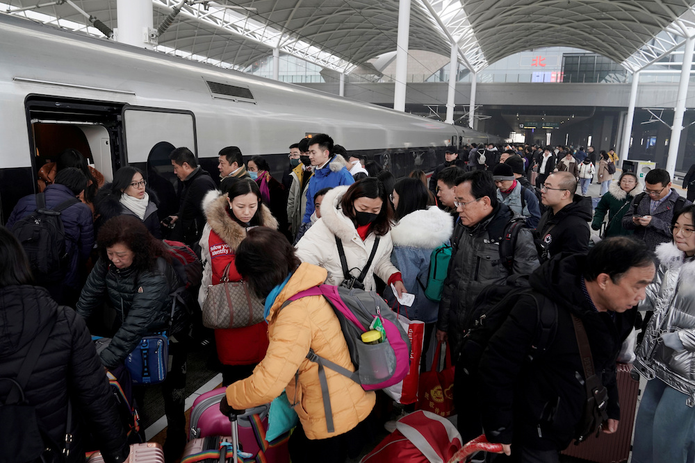 File picture of travellers boarding a train in China as the annual Spring Festival travel rush begins ahead of the Chinese Lunar New Year, in Shijiazhuang, Hebei province January 10, 2020. u00e2u20acu201d Reuters pic