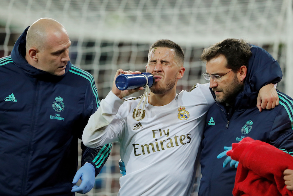 Real Madridu00e2u20acu2122s Eden Hazard receives medical attention after sustaining an injury during the Champions League Group A match with Paris St Germain at Santiago Bernabeu in Madrid November 26, 2019. u00e2u20acu201d Reuters pic