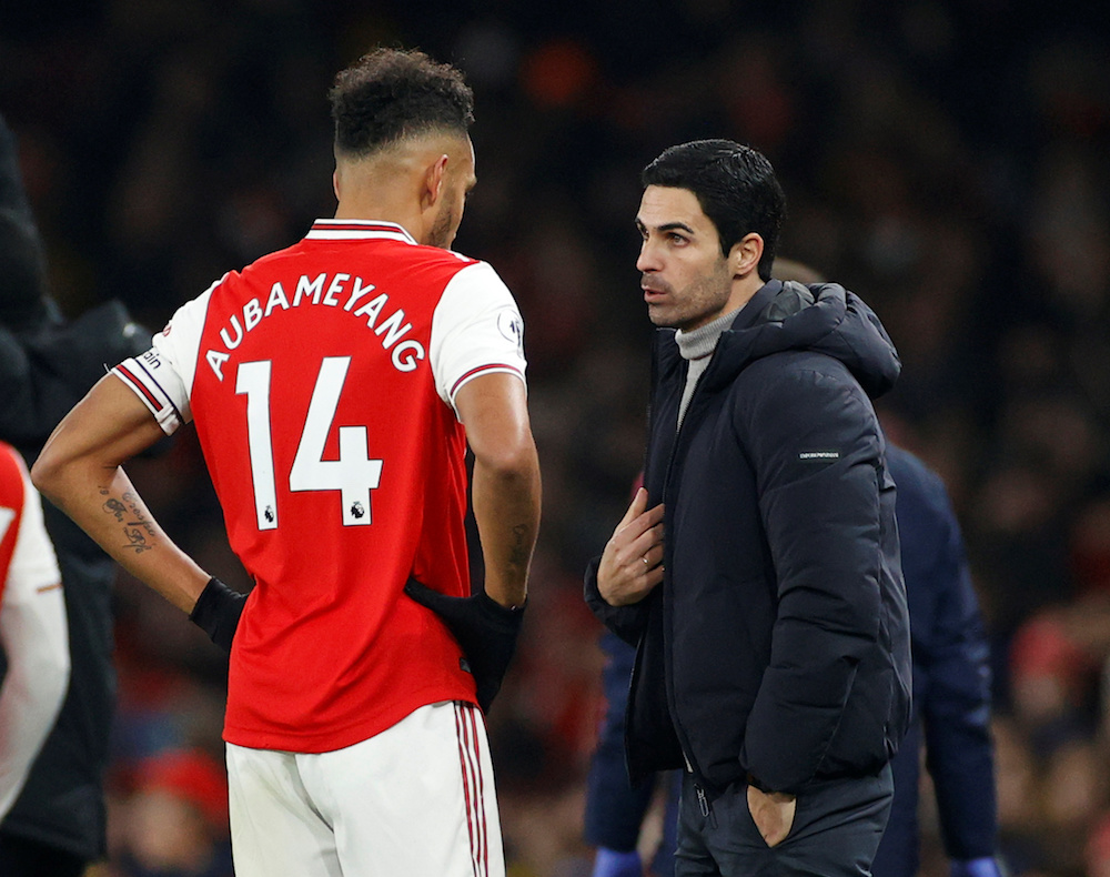 Arsenalu00e2u20acu2122s Pierre-Emerick Aubameyang talks to manager Mikel Arteta during the Premier League match with Manchester United at Emirates Stadium in London January 1, 2020. u00e2u20acu201d Action Images pic via Reuters