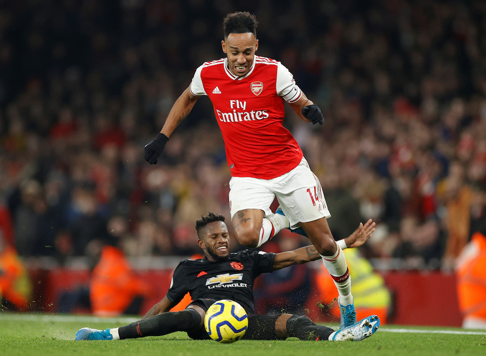 Arsenalu00e2u20acu2122s Pierre-Emerick Aubameyang in action with Manchester Unitedu00e2u20acu2122s Fred during their Premier League match at Emirates Stadium in London January 1, 2020. u00e2u20acu201d Action Images pic via Reuters