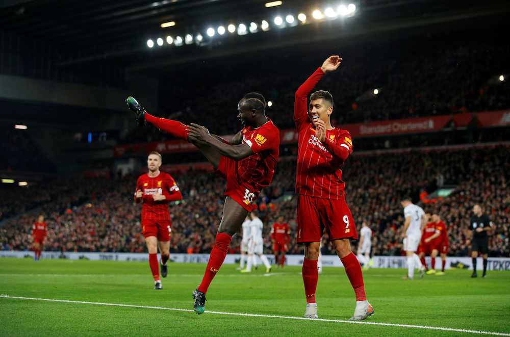Liverpoolu00e2u20acu2122s Sadio Mane celebrates scoring their second goal with Roberto Firmino during the Premier League with Sheffield United at Anfield in Liverpool January 2, 2020. u00e2u20acu201d Reuters pic