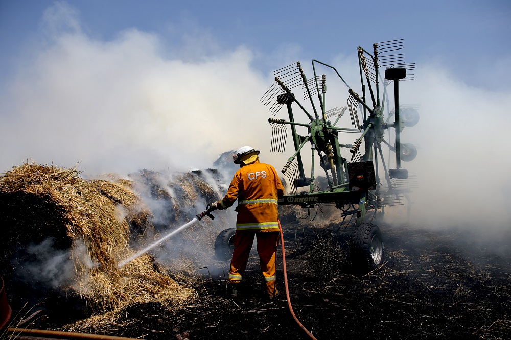 Country Fire Service members put out a fire which reached hay bales on a property at Mount Torrens in the Adelaide Hills, Australia January 3, 2020. u00e2u20acu201d AAP Image/Kelly Barnes/via Reuters