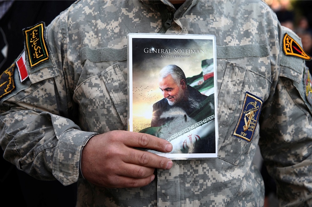 A demonstrator holds the picture of Qassem Soleimani during a protest against the assassination of the Iranian Major-General Qassem Soleimani in Tehran January 3, 2020. u00e2u20acu201d Picture by WANA (West Asia News Agency)/Nazanin Tabatabaee via Reuters