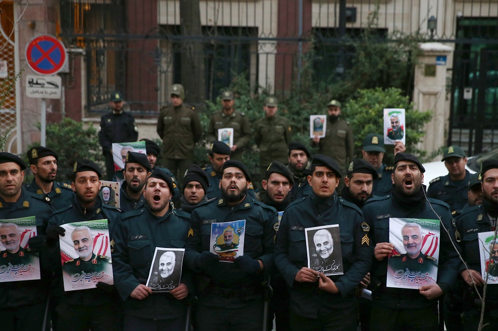 Iranian policemen hold pictures of the late Iranian Major-General Qassem Soleimani, during a protest against the assassination of Soleimani, in Tehran January 3, 2020. u00e2u20acu201d Picture by WANA (West Asia News Agency)/Nazanin Tabatabaee via Reuters