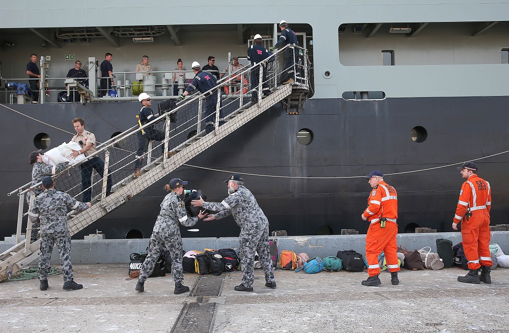 Evacuees arrive from Mallacoota on the navy ship MV Sycamore at the port of Hastings, Victoria January 4, 2020. u00e2u20acu201d AAP Image/News Corp Pool, Ian Currie/ via Reuters