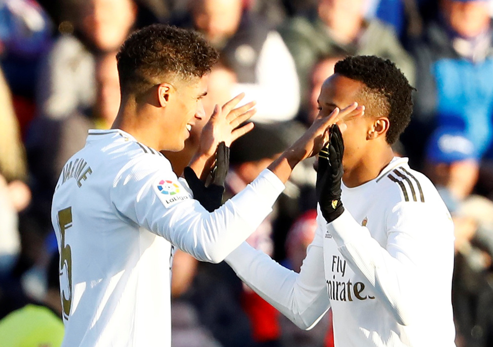 Real Madridu00e2u20acu2122s Raphael Varane celebrates scoring their second goal with Real Madridu00e2u20acu2122s Eder Militao during the La Liga match with Getafe at Coliseum Alfonso Perez in Getafe January 4, 2020. u00e2u20acu201d Reuters pic
