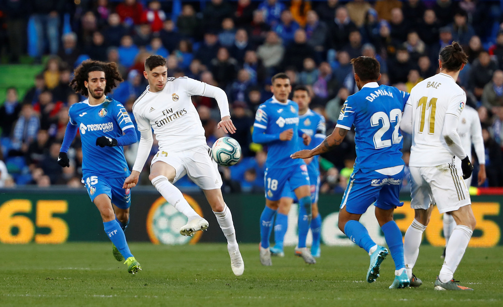 Real Madridu00e2u20acu2122s Federico Valverde in action with Getafeu00e2u20acu2122s Marc Cucurella during their La Liga match at Coliseum Alfonso Perez in Getafe January 4, 2020. u00e2u20acu201d Reuters pic