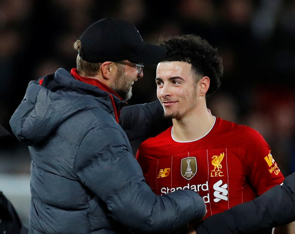 Liverpoolu00e2u20acu2122s Curtis Jones celebrates with manager Jurgen Klopp after the FA Cup third round match with Everton at Anfield in Liverpool January 5, 2020. u00e2u20acu201d Reuters pic