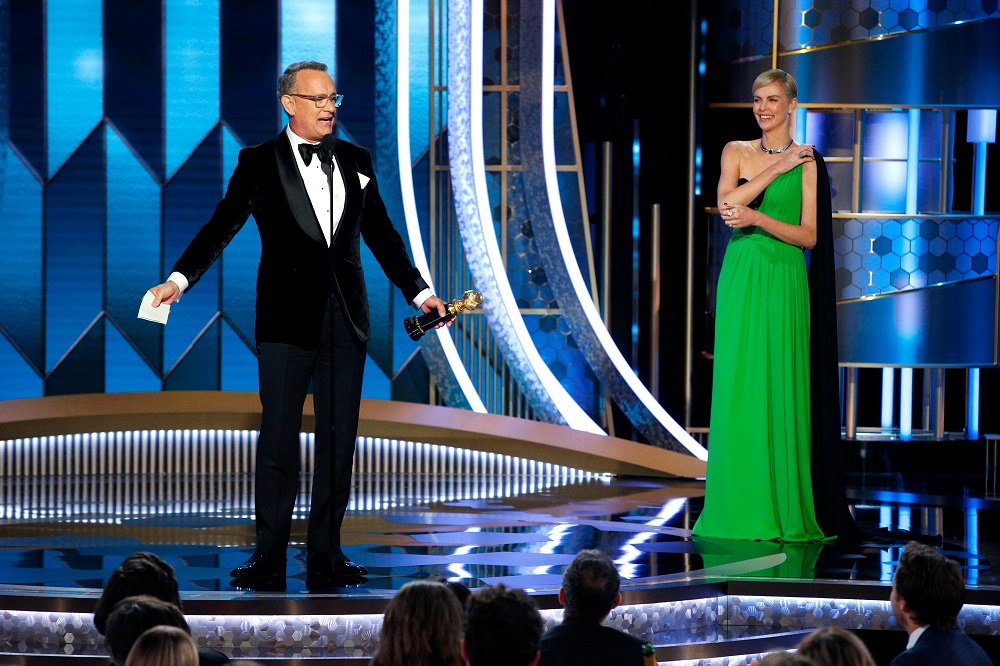 Tom Hanks accepts the Cecil B. DeMille Award as Charlize Theron looks on during the Golden Globe Awards in Californua January 5, 2020. u00e2u20acu201d Picture by Paul Drinkwater/NBC Universal/Handout via Reuters