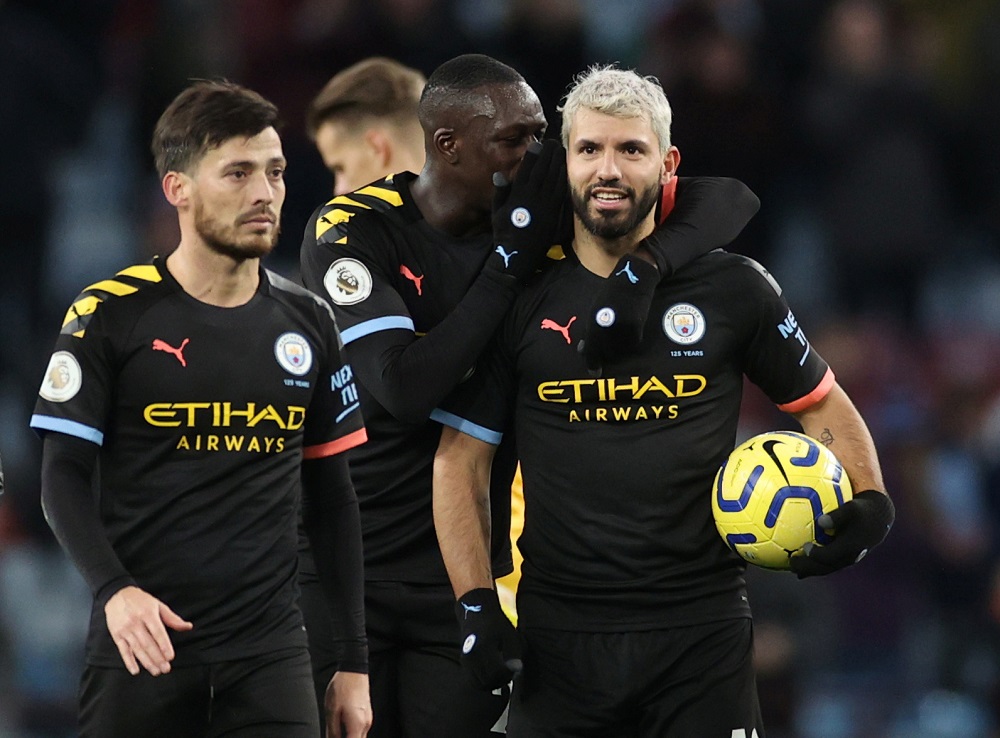 Manchester City's Sergio Aguero celebrates with the match ball, Benjamin Mendy and David Silva at the end of the game against Aston Villa at Villa Park, Birmingham January 12, 2020. u00e2u20acu201d Action Images via Reuters