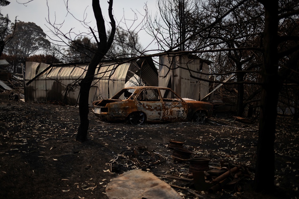 The remains of a car, burnt by a bushfire, stands in front of a destroyed structure, in the town of Cobargo, New South Wales January 12, 2020. u00e2u20acu201d Reuters pic