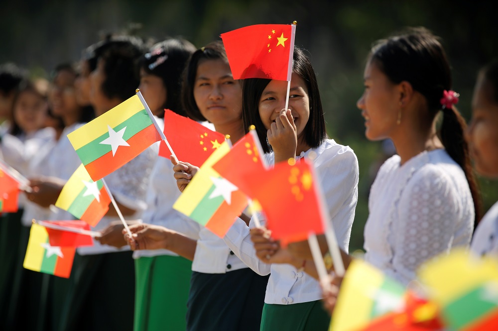 Myanmar students hold Myanmar and Chinese flags as they prepare to welcome Chinese President Xi Jinping outside of the airport in Naypyitaw, Myanmar January 17, 2020. u00e2u20acu201d Reuters pic
