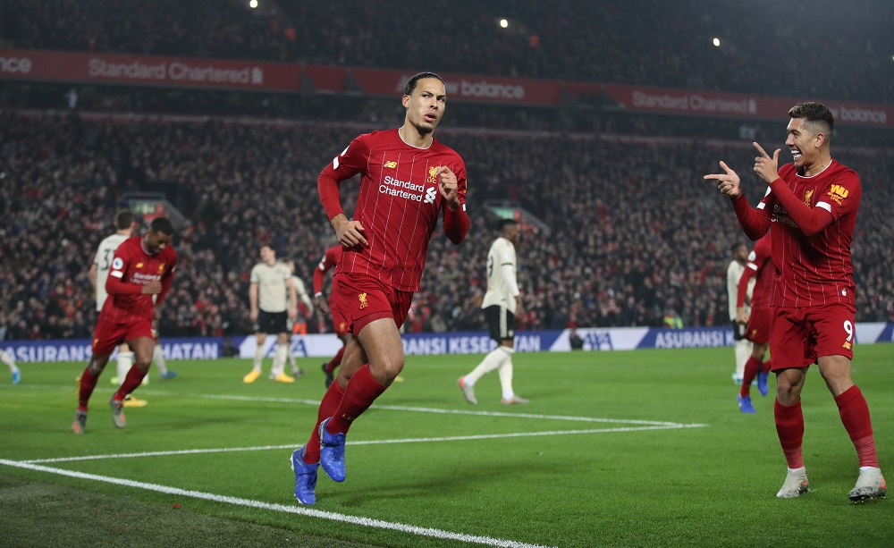 Liverpoolu00e2u20acu2122s Virgil van Dijk celebrates scoring their first goal with Roberto Firmino at Anfield in Liverpool January 19, 2020. u00e2u20acu201d Action Images via Reuters