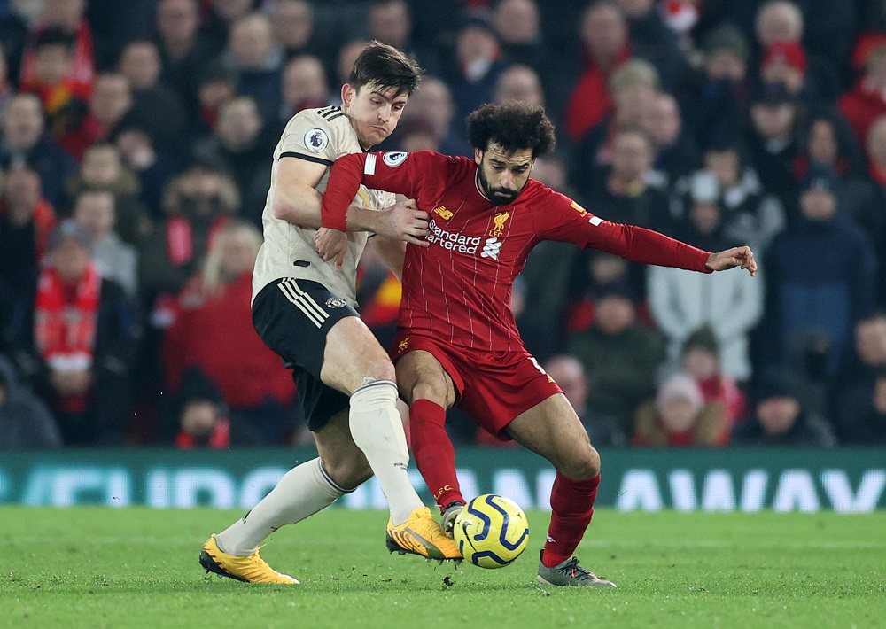 Manchester United's Harry Maguire in action with Liverpool's Mohamed Salah at Anfield in Liverpool January 19, 2020. u00e2u20acu201d Action Images via Reuters
