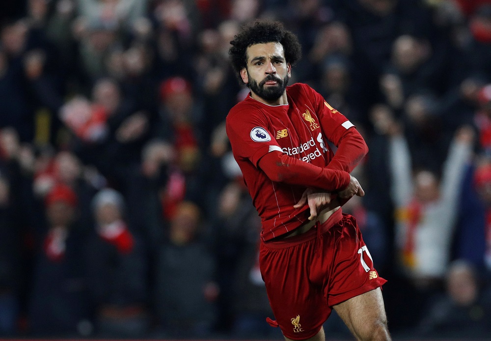 Liverpool's Mohamed Salah takes his shirt off as he celebrates scoring their second goal against Manchester United at Anfield in Liverpool January 19, 2020. u00e2u20acu201d Reuters pic 