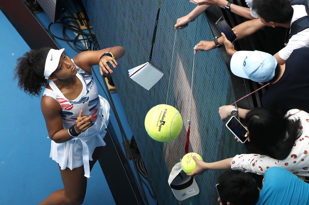 Naomi Osaka signs autographs for fans after winning the match against Marie Bouzkova in Melbourne January 20, 2020. u00e2u20acu201d Reuters pic