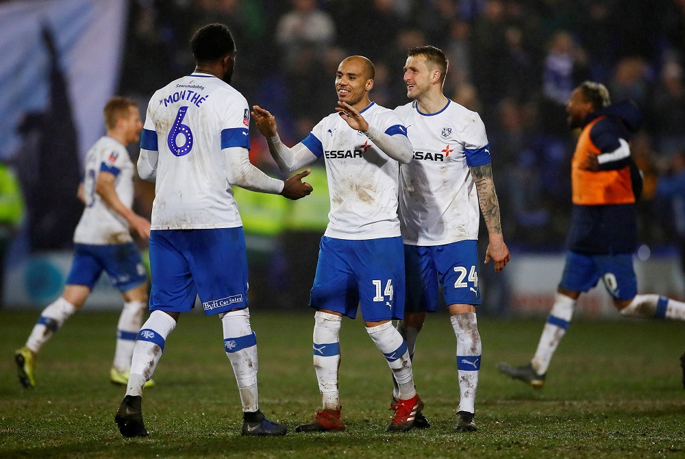 Tranmere Rovers' Emmanuel Monthe, Jake Caprice and Peter Clarke celebrate after the match against Watford at Prenton Park in Birkenhead January 23, 2020. u00e2u20acu201d Action Images via Reuters