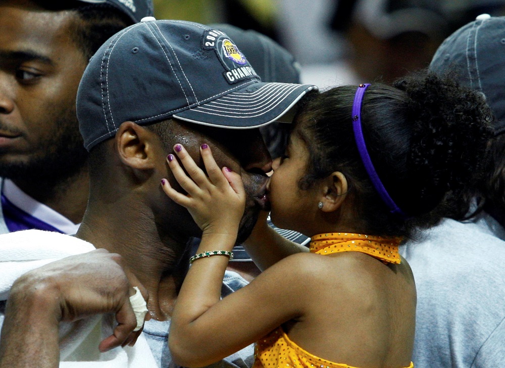File photo showing Los Angeles Lakers Kobe Bryant kissing his daughter Gianna after they defeated the Orlando Magic to win the NBA basketball championship in Orlando, Florida June 14, 2009. — Reuters pic