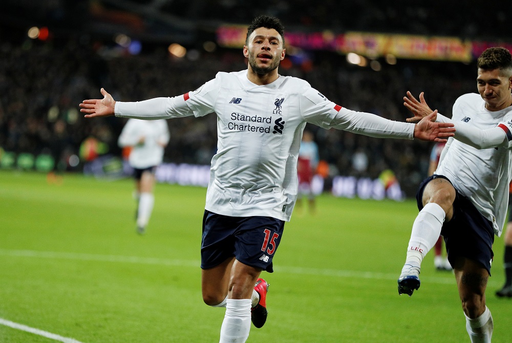 Liverpoolu00e2u20acu2122s Alex Oxlade-Chamberlain celebrates scoring their second goal with Roberto Firmino against West Ham United at the London Stadium in London January 29, 2020. u00e2u20acu201d Action Images via Reuters