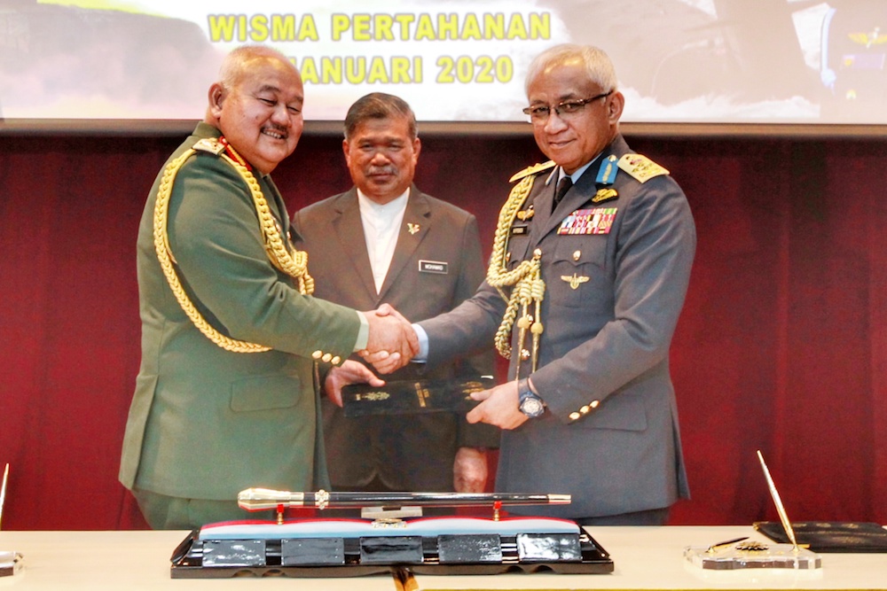 Defence Minister Mohamad Sabu witnesses the handover of duties as Armed Forces chief from General Tan Sri Zulkifli Zainal Abidin to General Tan Sri Affendi Buang (right) at the Defence Ministry in Kuala Lumpur January 2, 2020. u00e2u20acu201d Picture by Ahmad Zamzahu