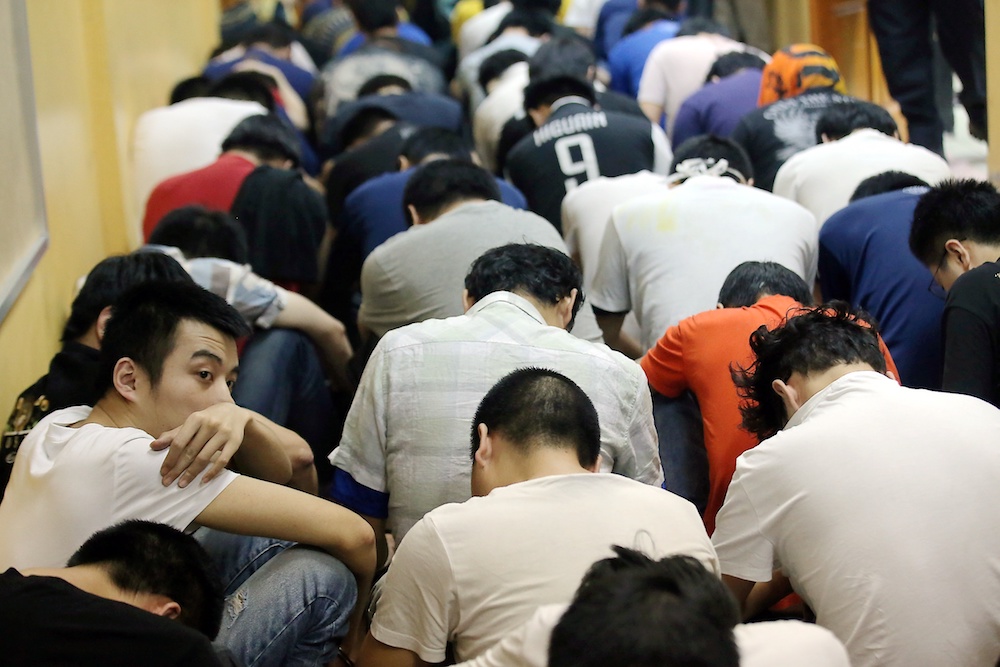 Some of the 131 Chinese nationals, including eight women, who were arrested in an immigration bust are seen at the Sessions Court in Teluk Intan January 2, 2020. u00e2u20acu201d Picture by Farhan Najib