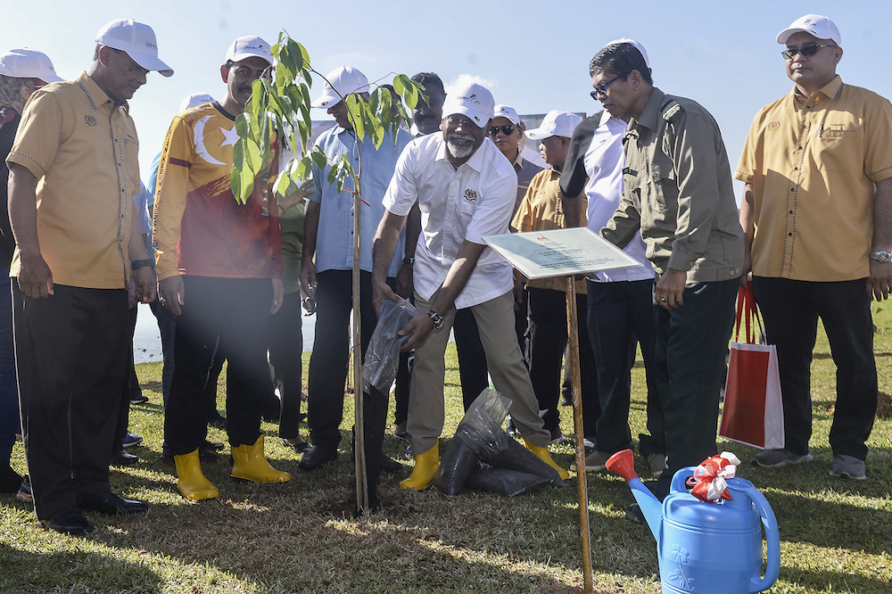 Datuk Dr Xavier Jayakumar plants a tree after launching the Restoration, Reclamation and Rehabilitation Through Tree Planting Programme in Klang January 5, 2020. u00e2u20acu201d Picture by Miera Zulyana