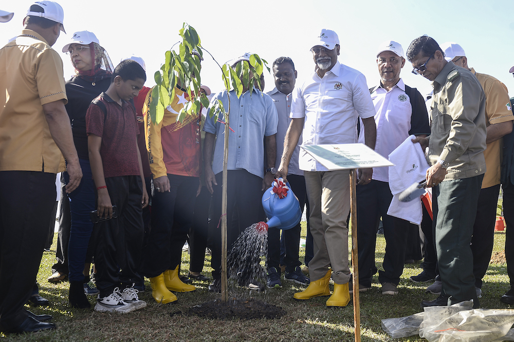 Datuk Dr Xavier Jayakumar plants a tree after launching the Restoration, Reclamation and Rehabilitation Through Tree Planting Programme in Klang January 5, 2020. u00e2u20acu201d Picture by Miera Zulyana