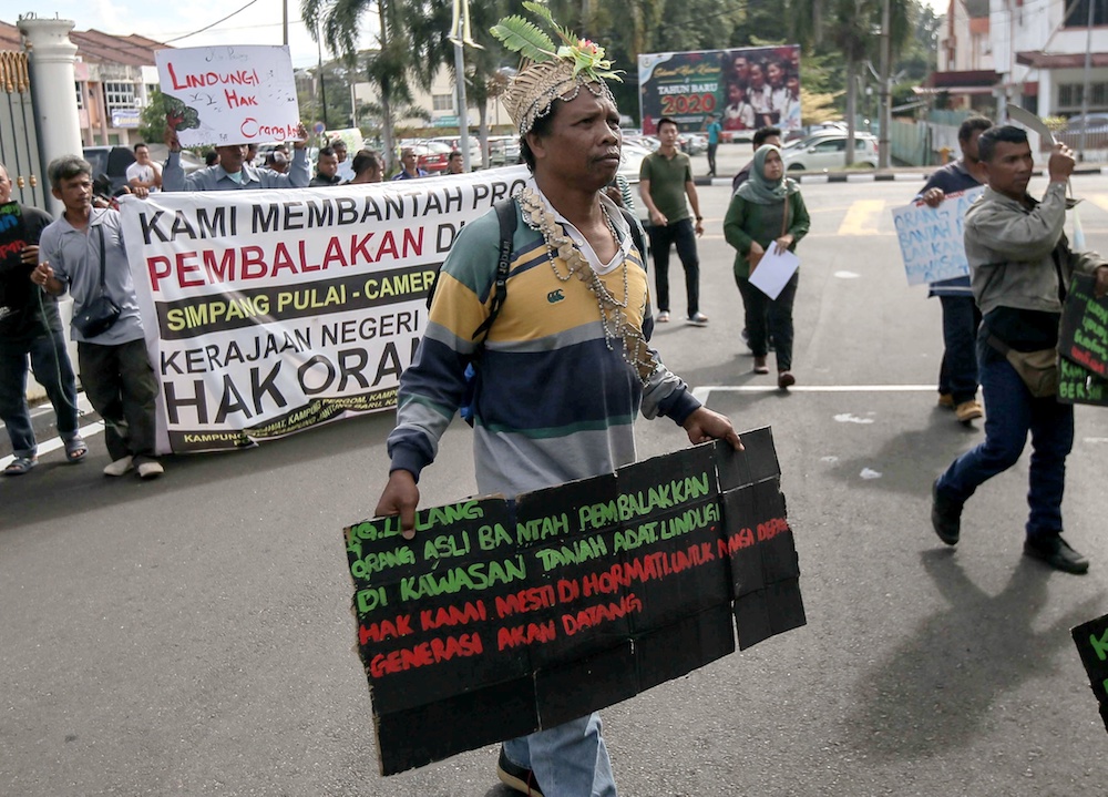 A group of Orang Asli together with environmental groups demonstrate at the State Secretariat Building in Ipoh January 8, 2020. — Picture by Farhan Najib