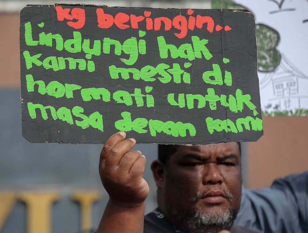 A group of Orang Asli together with environmental groups demonstrate at the State Secretariat Building in Ipoh January 8, 2020. — Picture by Farhan Najib