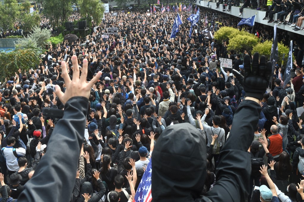 People take part in a 'universal siege on communists' rally at Chater Garden in Hong Kong on January 19, 2020. u00e2u20acu201d AFP picnn