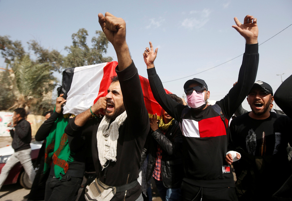 Mourners carry a coffin of an Iraqi activist female protester, who was killed by an unknown gunmen at anti-government protests, during a funeral in Basra January 22, 2020. u00e2u20acu201d Reuters pic 